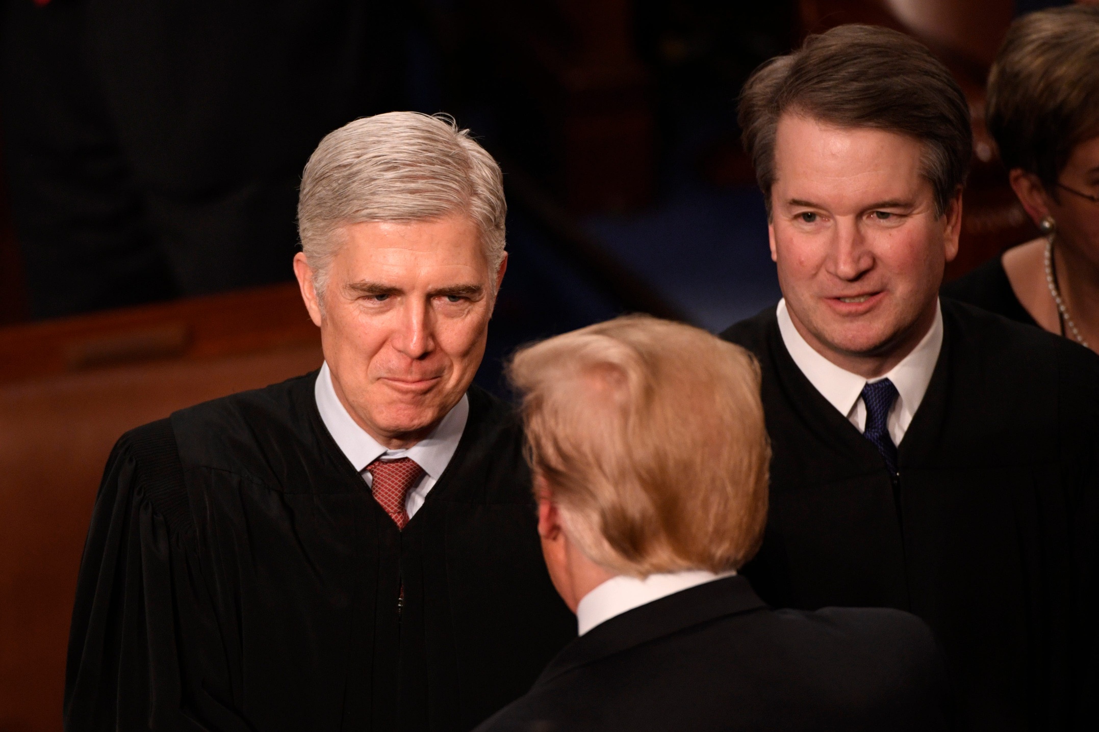 Justices Neil Gorsuch and Brett Kavanaugh greet President Donald Trump 